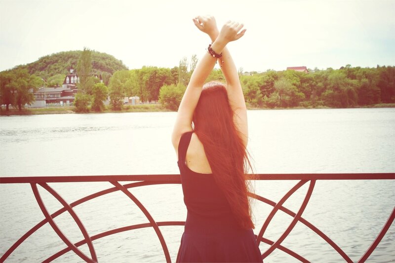 Woman stretching by the river