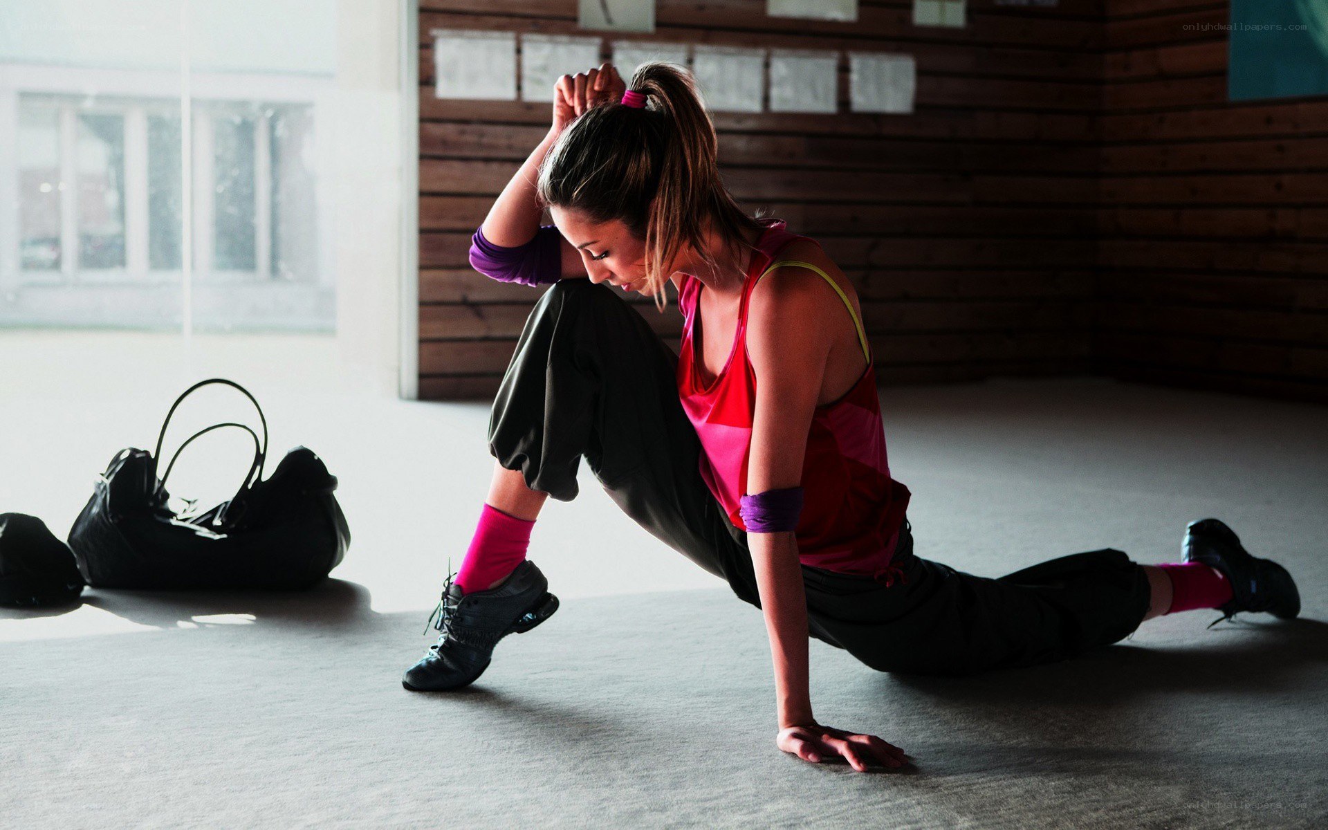 woman stretching in dance studio