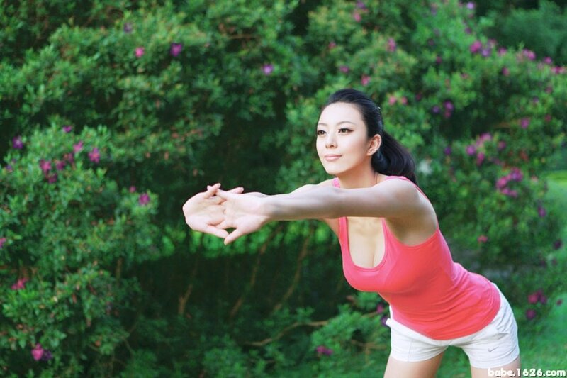 woman stretching in garden