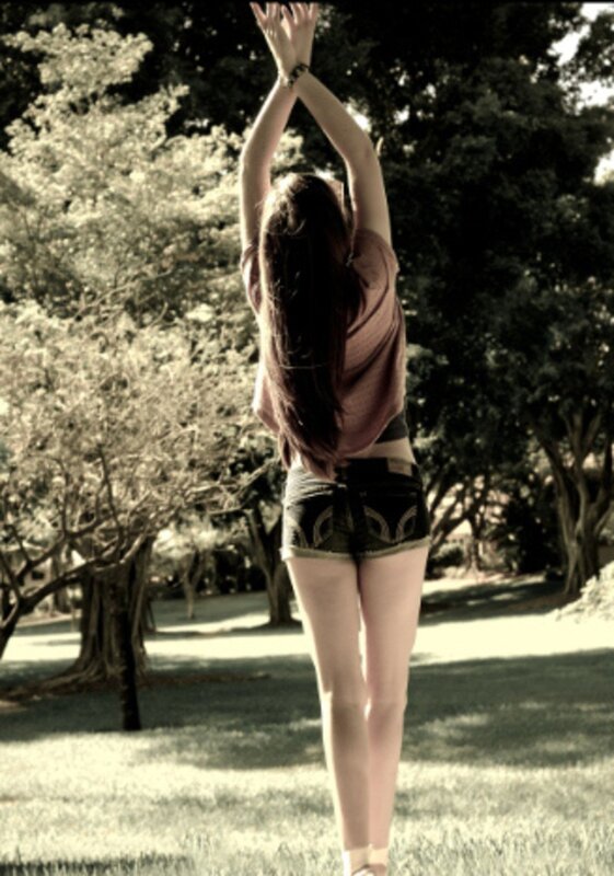 woman stretching in park