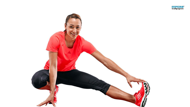 Woman Stretching in Red Shirt