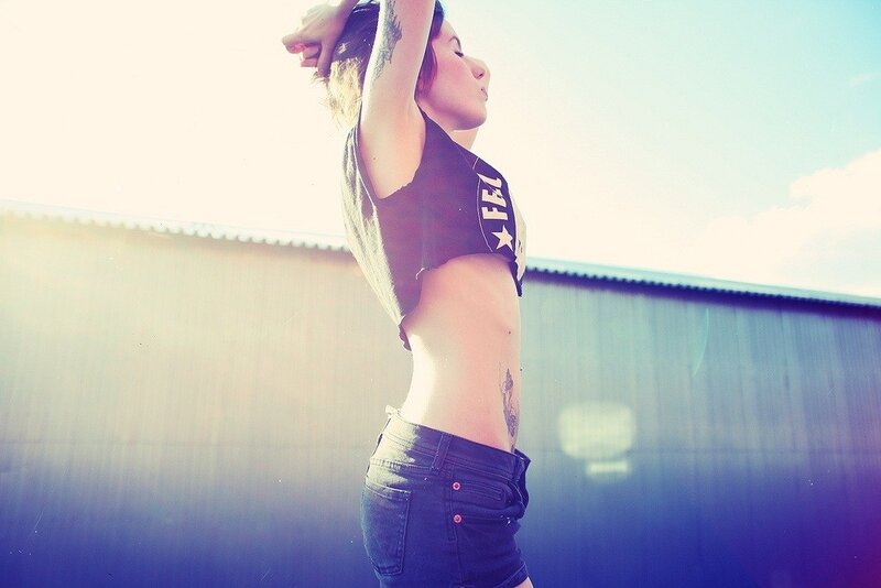 woman stretching in sunlight