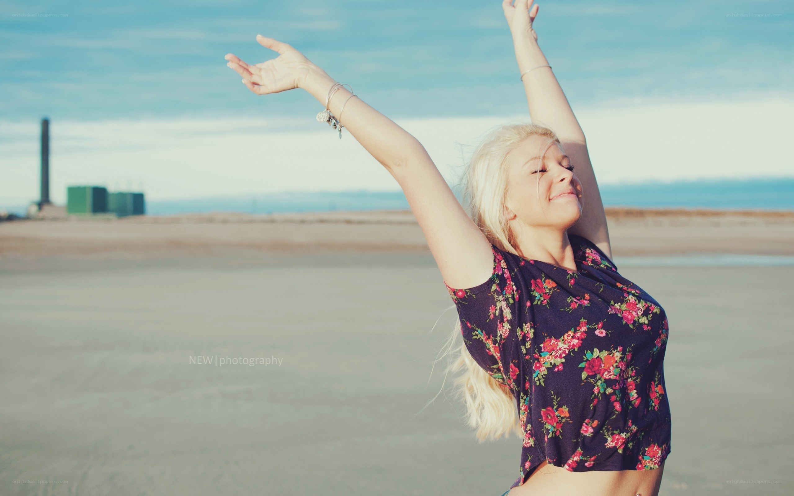 woman stretching on beach
