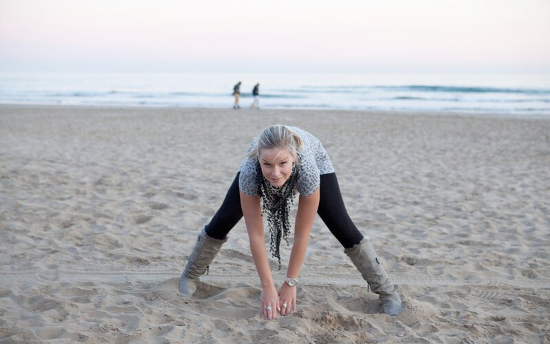 Woman stretching on the beach