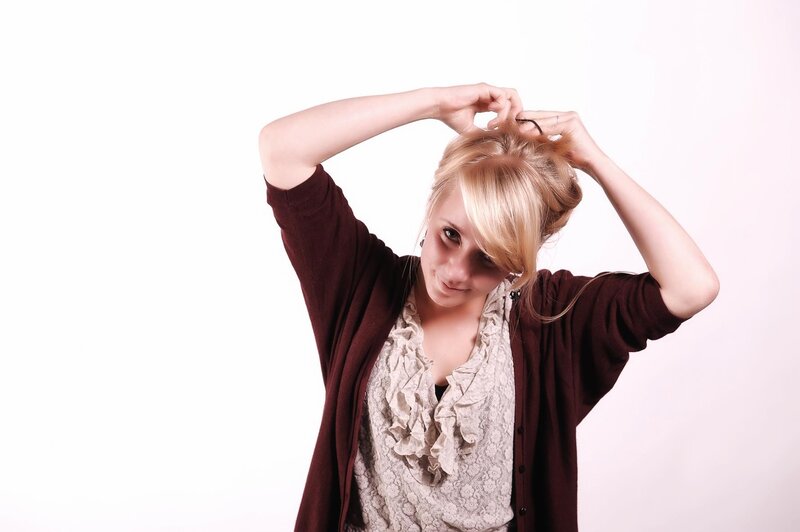 woman styling her hair