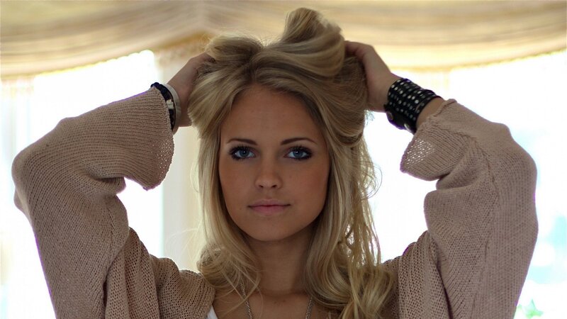 woman styling her hair