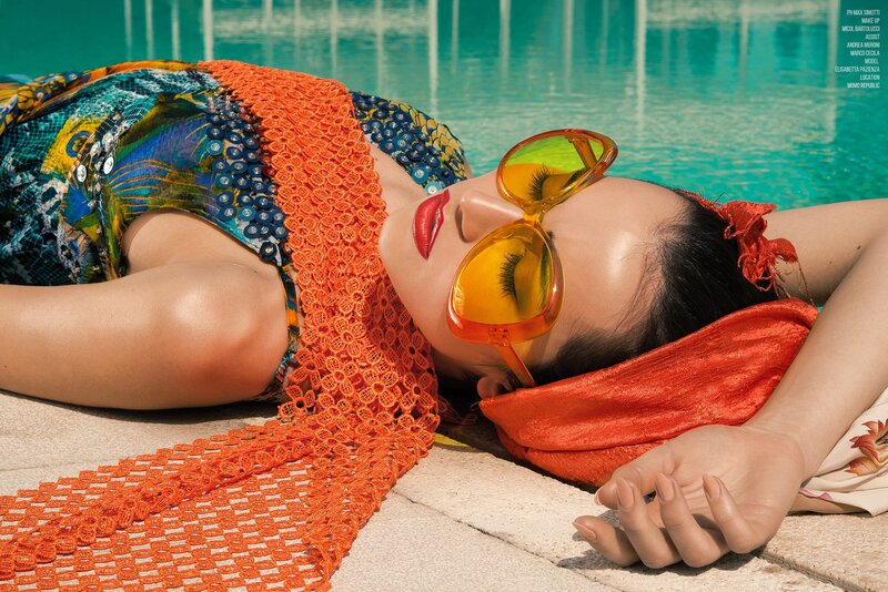Woman Sunbathing by Pool — Orange