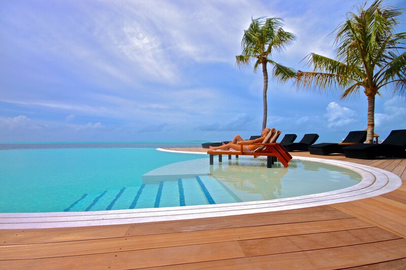 Woman Sunbathing by Pool