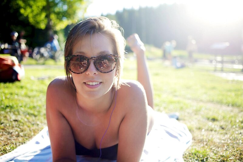 Woman sunbathing in park