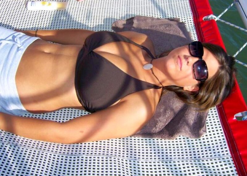 Woman sunbathing on a boat