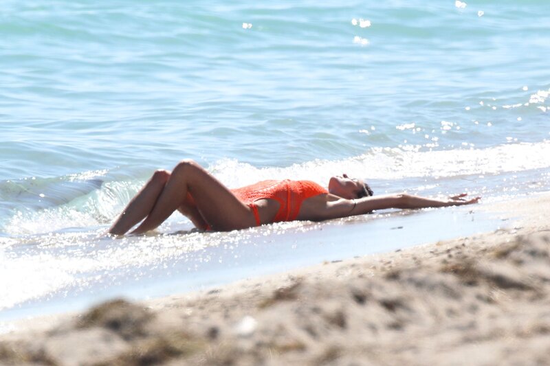 Woman sunbathing on beach