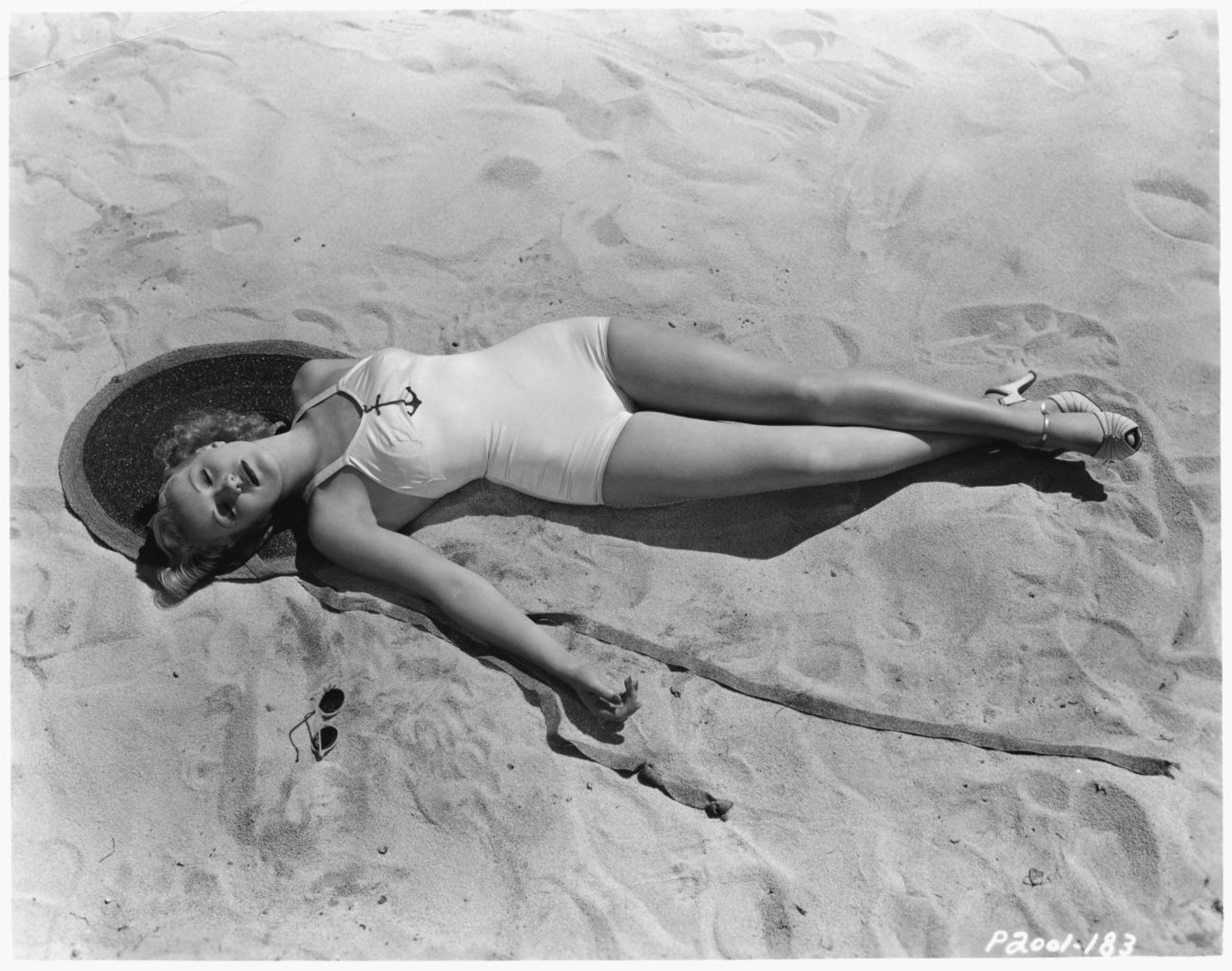 Woman sunbathing on beach