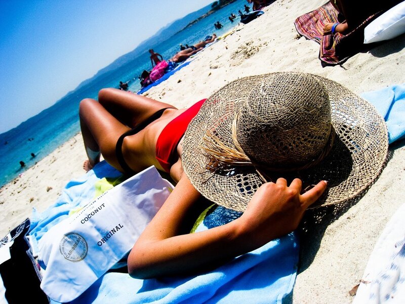 Woman sunbathing on beach