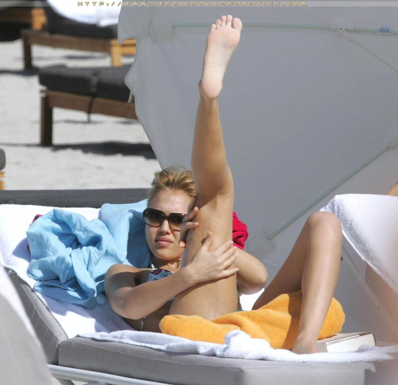 woman sunbathing on beach