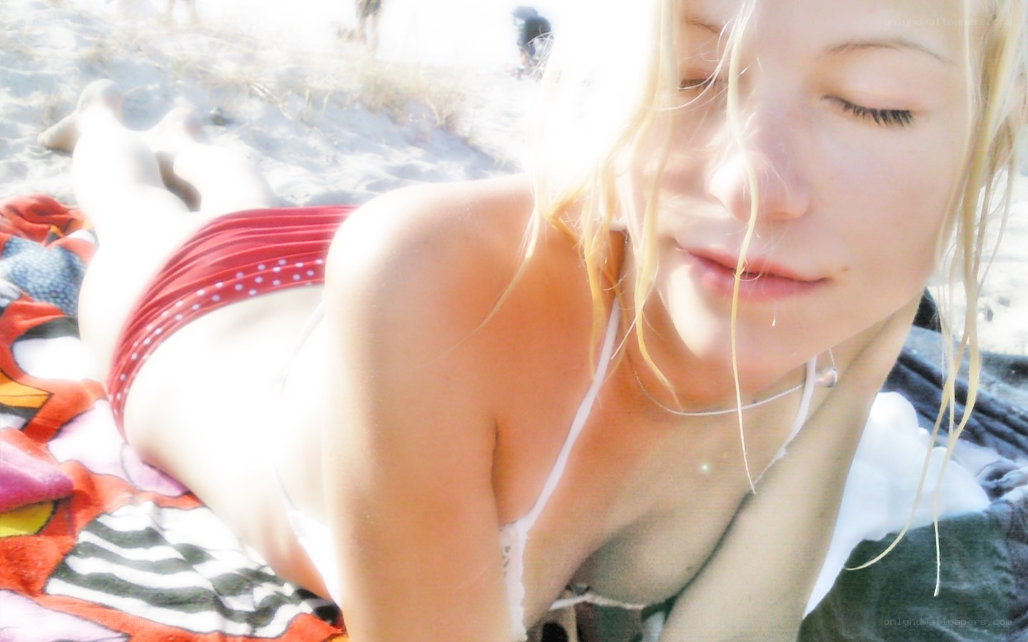 woman sunbathing on beach
