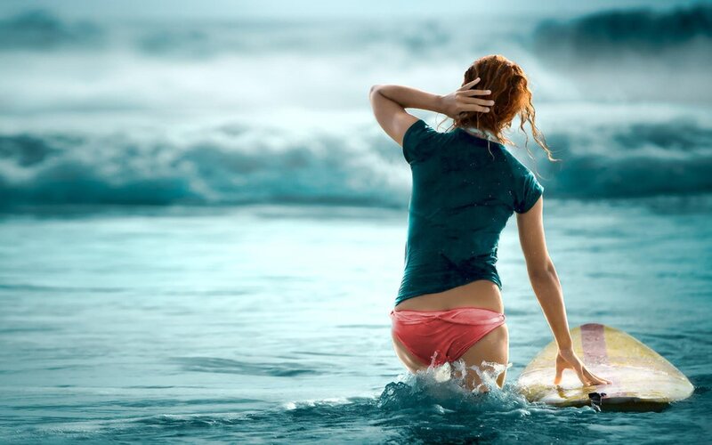 woman surfing in ocean