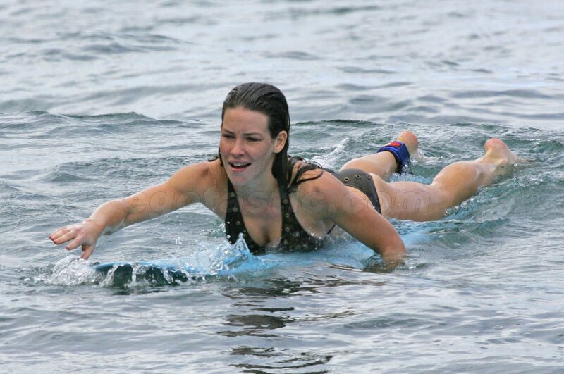 woman surfing in ocean