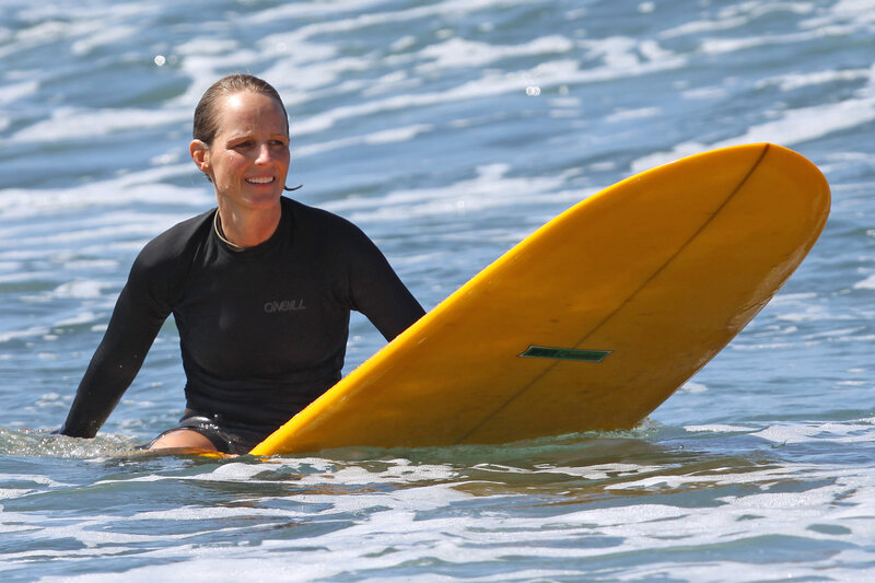 woman surfing in ocean
