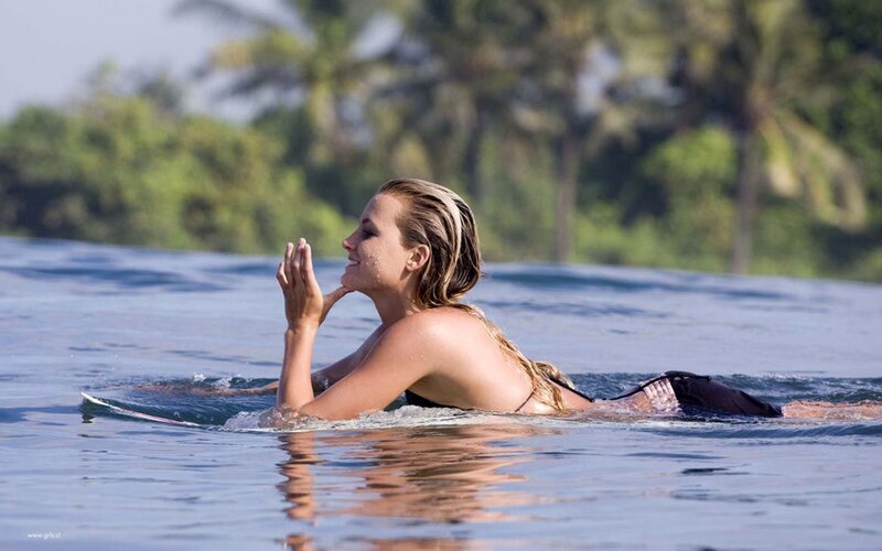 woman surfing in ocean