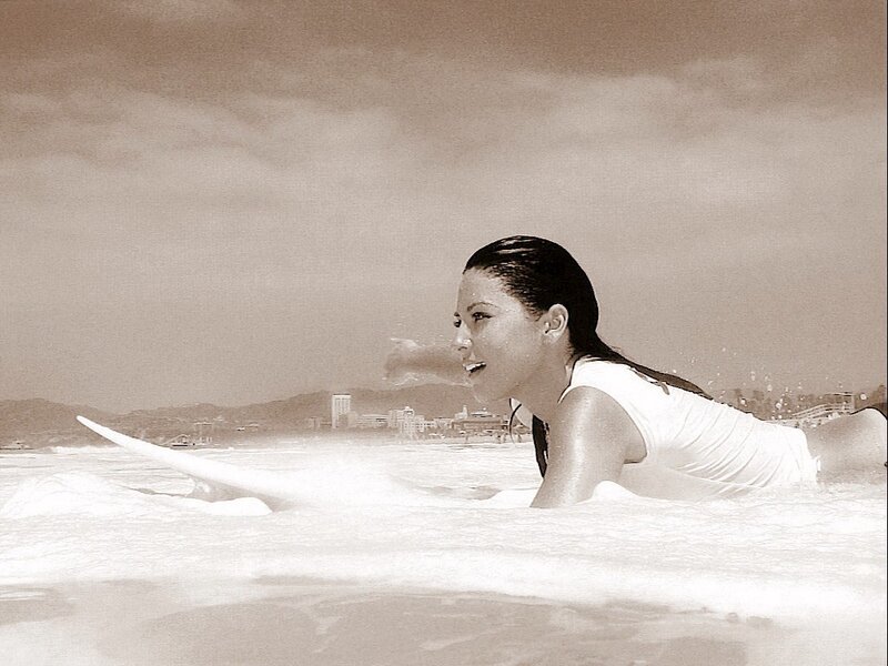 woman surfing in ocean