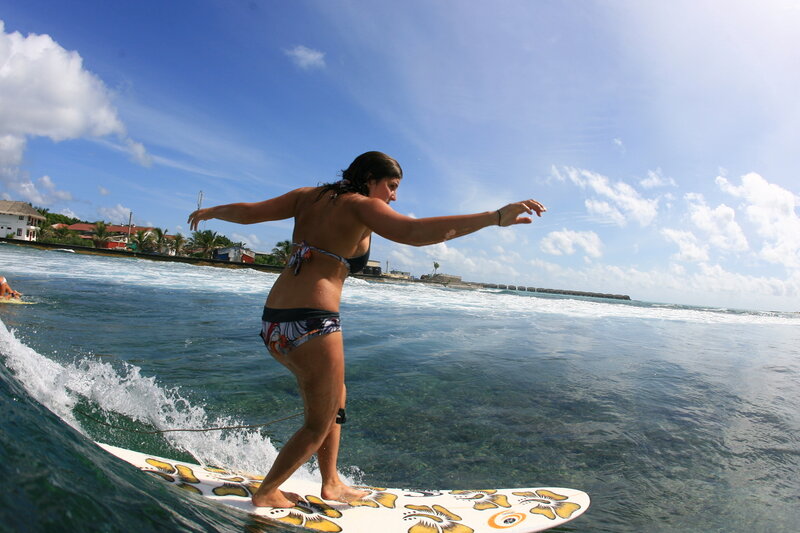 woman surfing on a wave