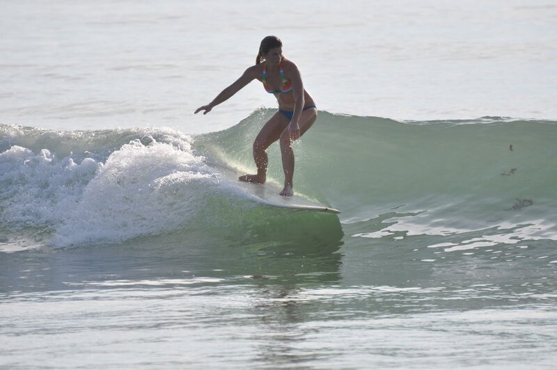woman surfing on a wave