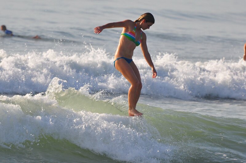 woman surfing on a wave