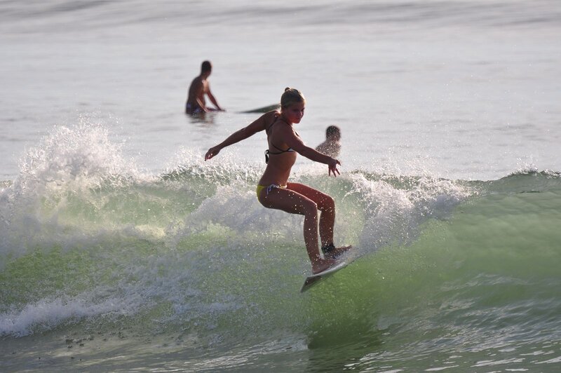 woman surfing on a wave