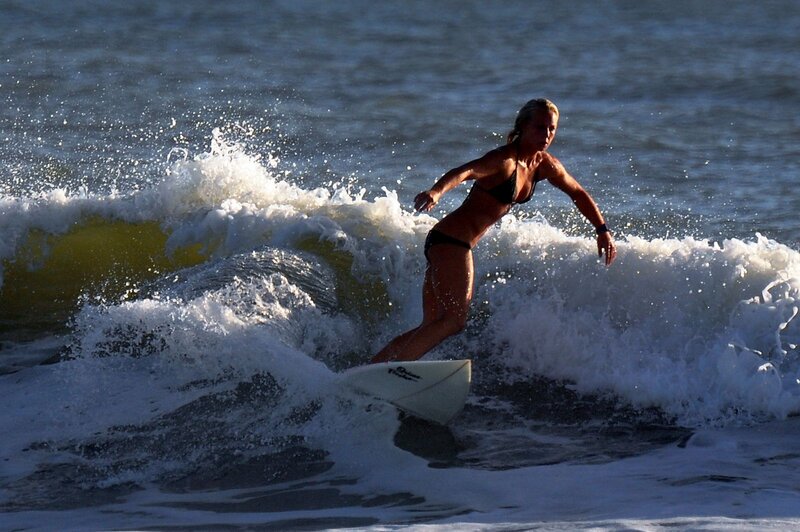woman surfing on a wave