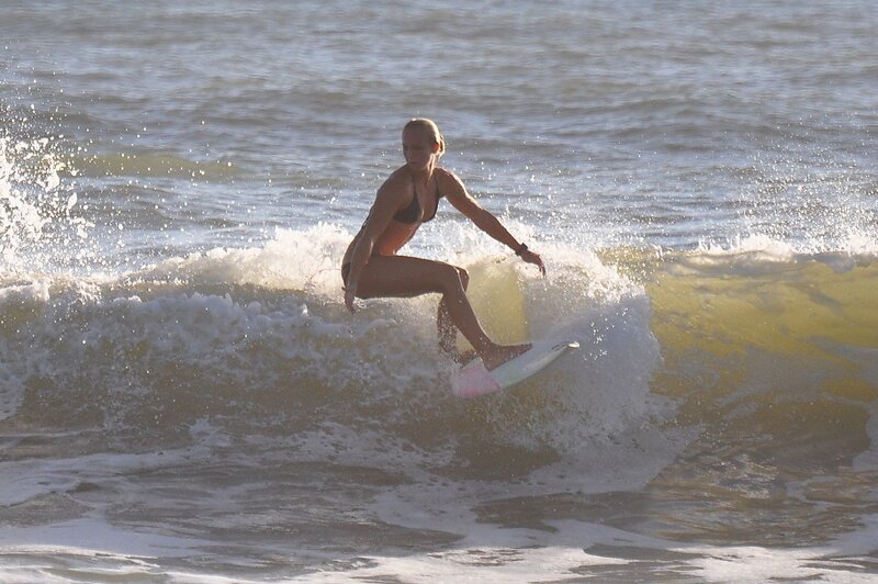 woman surfing on a wave