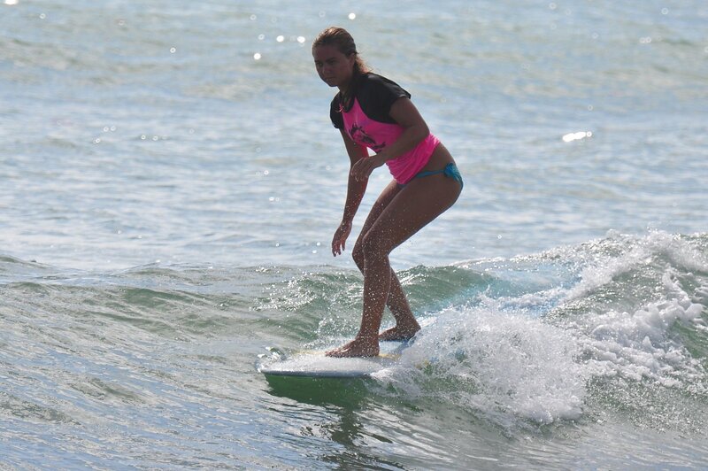 woman surfing on a wave