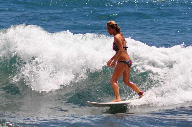 woman surfing on a wave