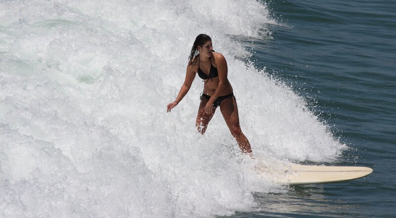 woman surfing on a wave