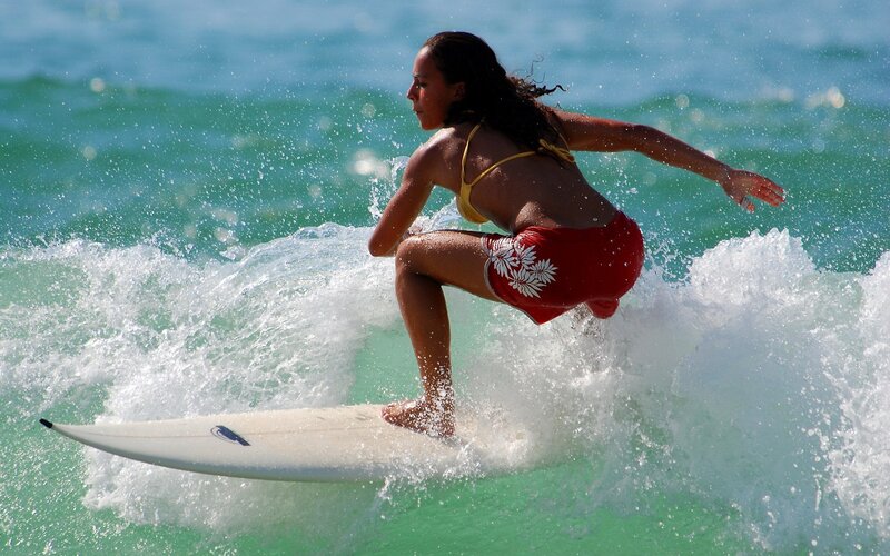 woman surfing on a wave