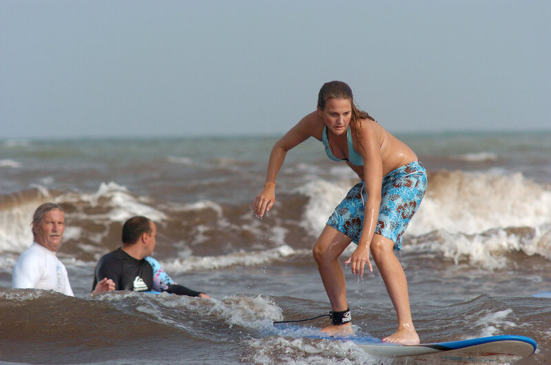 Woman surfing on a wave