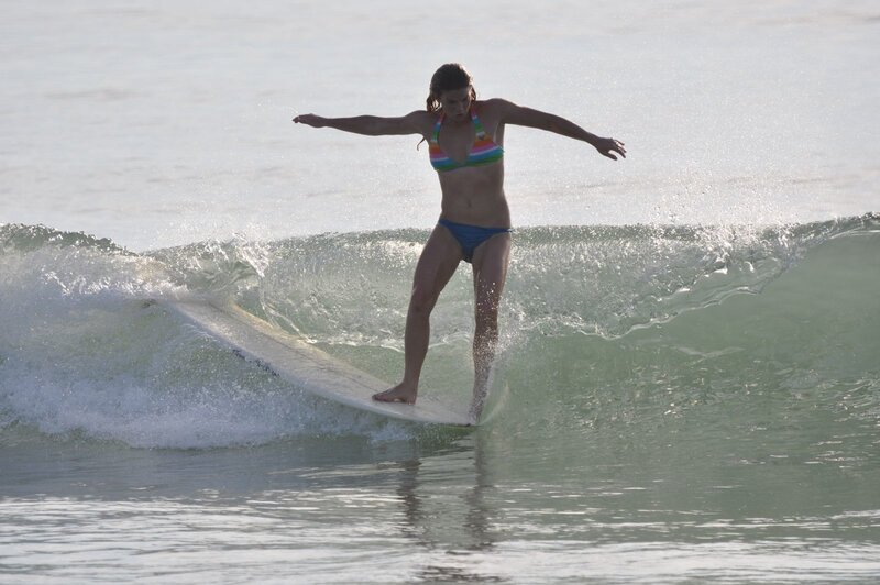 woman surfing on a wave