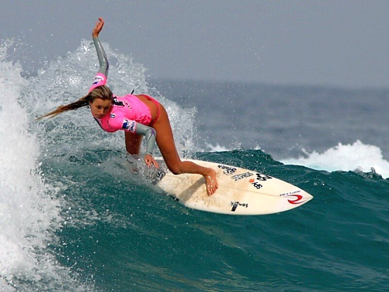 woman surfing on a wave