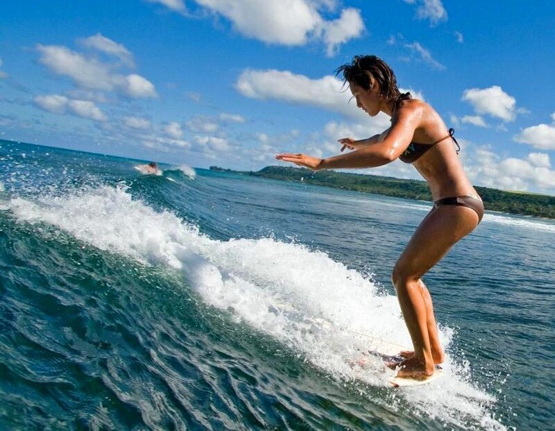 woman surfing on a wave