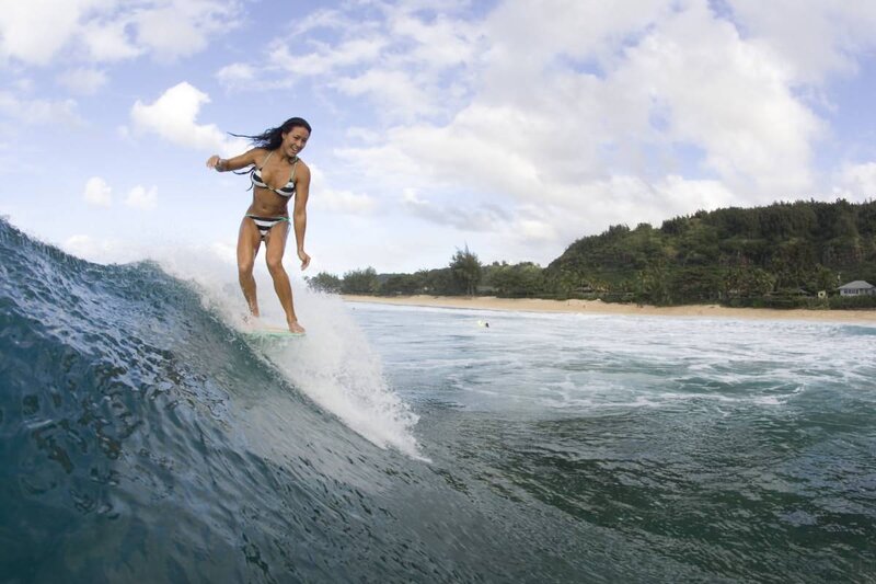woman surfing on a wave