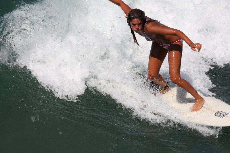 woman surfing on a wave