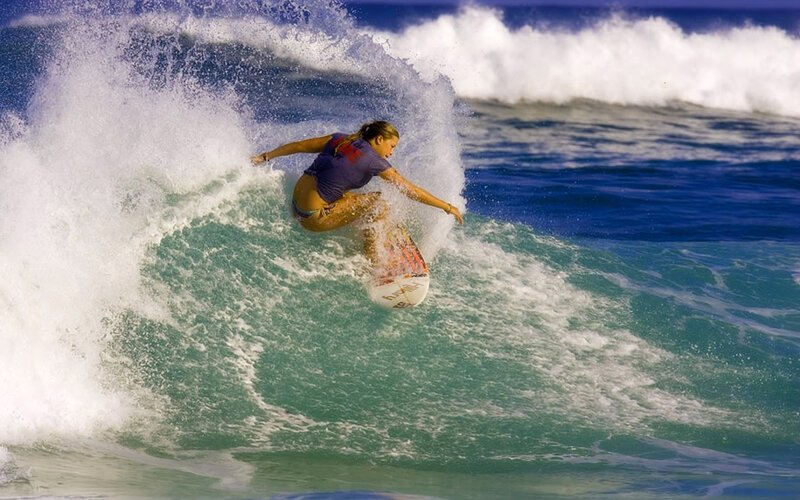 Woman Surfing Wave