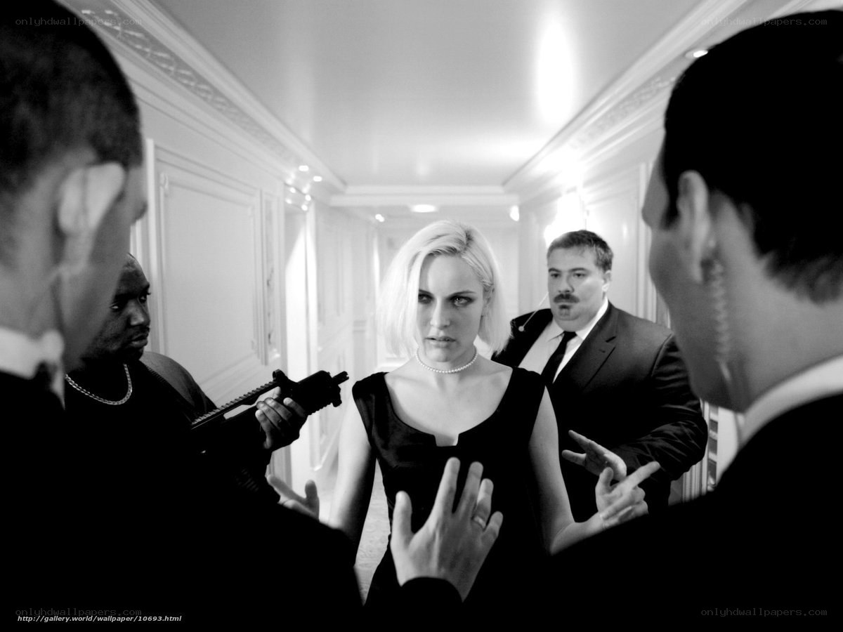 woman surrounded by armed men