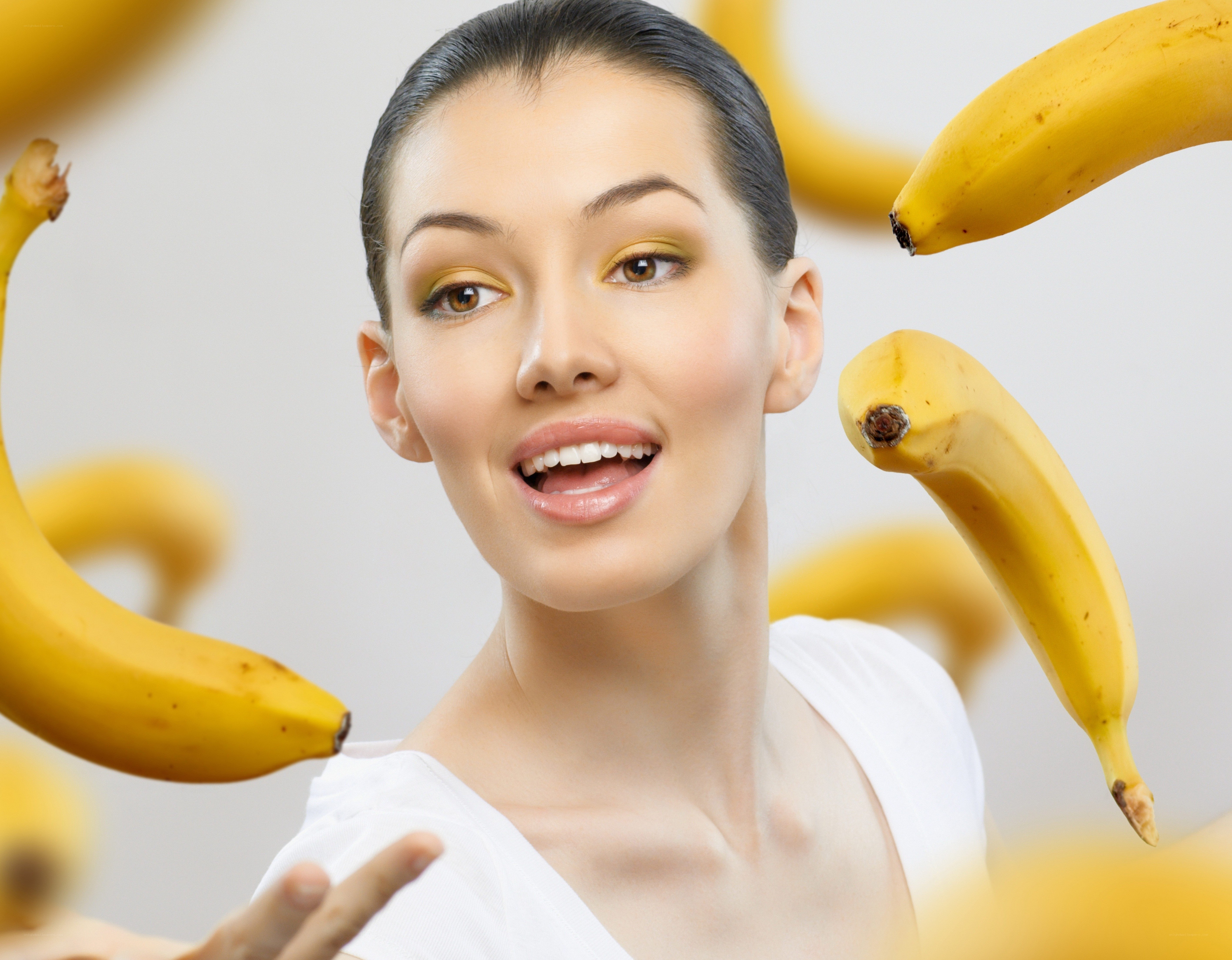 woman surrounded by bananas