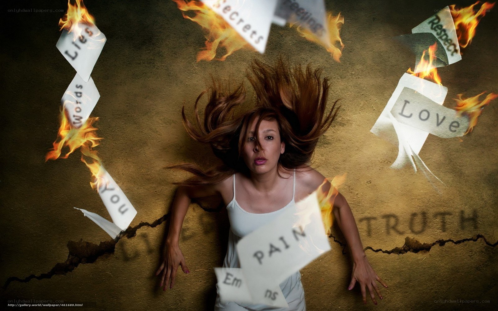 Woman surrounded by burning papers