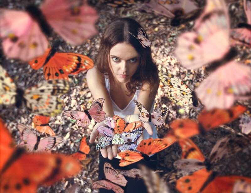 Woman Surrounded by Butterflies — Pink