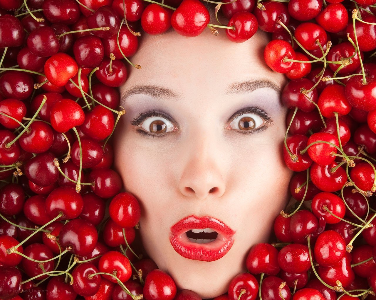 woman surrounded by cherries