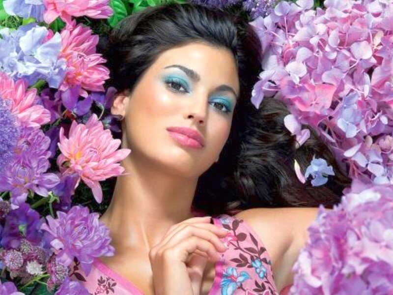 woman surrounded by flowers