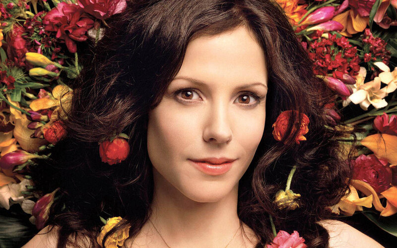 woman surrounded by flowers