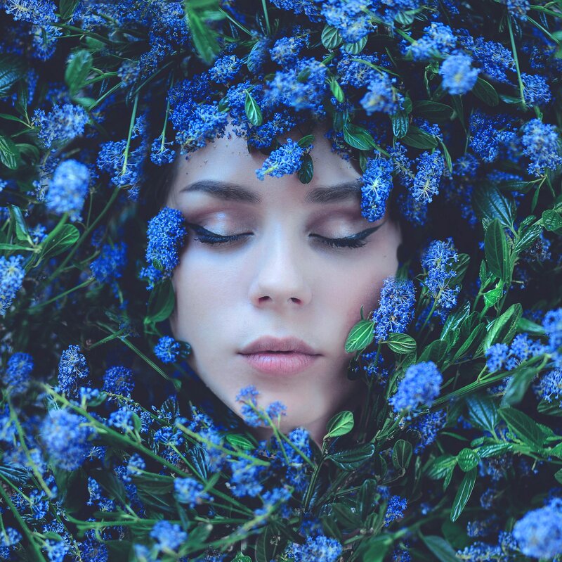 Woman Surrounded by Flowers — Blue