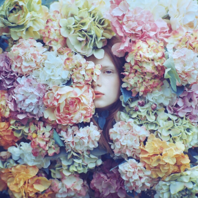 Woman Surrounded by Flowers — Pink, Serene, Photograph, Face